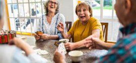 Assisted living amenities residents playing cards